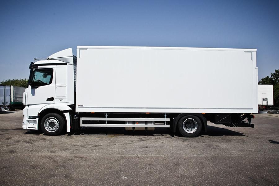 White rigid cargo truck with box body, side view