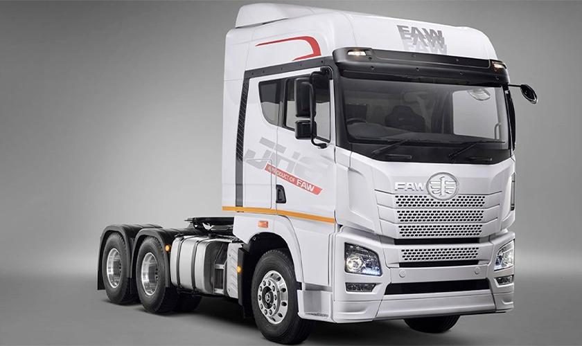 White heavy-duty 6x4 tractor unit, three-quarter front view